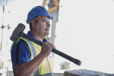 Confident construction worker with sledgehammer - ZEF009179