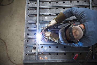 Metal construction, welder welding railing - REAF000092