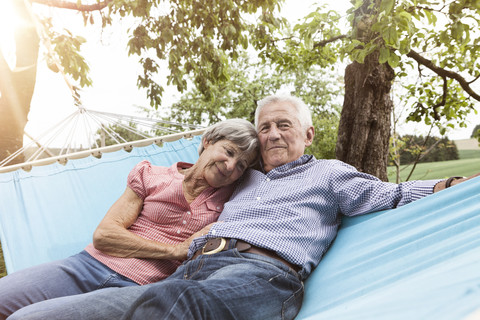 Senior couple relaxing in hammock stock photo