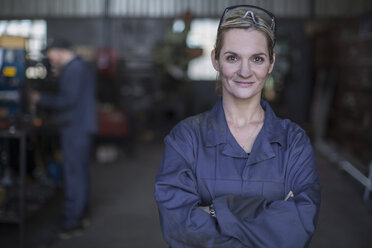Portrait of confident female mechanic in workshop - ZEF009313
