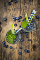 Glasses of infused water with lime, blueberries and mint - LVF005179