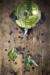 Glass of infused water with lime, blueberries and mint - LVF005182
