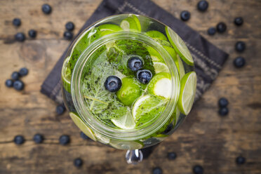 Glass of infused water with lime, blueberries and mint - LVF005183