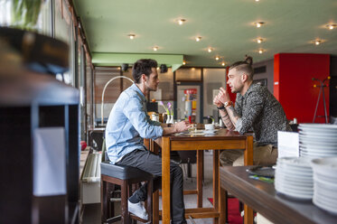 To young men socializing in a cafe - DIGF000806