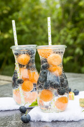 Carafes of infused water with blueberries and melon - SARF002829