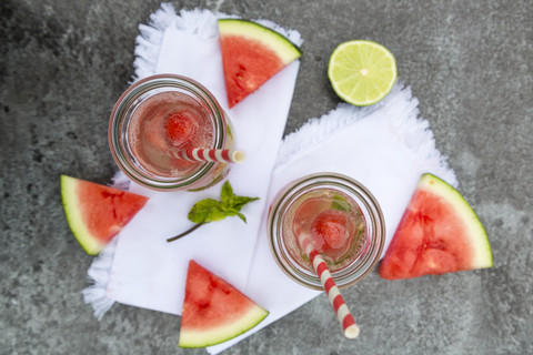 Two carafes of infused water with watermelon and lime stock photo