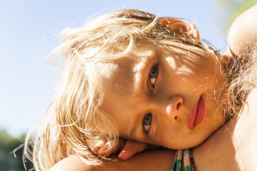 Portrait of little boy with head on his mother's shoulder - TCF005051