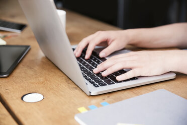 Close-up of woman's hands using laptop - REAF000093