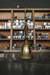 Bell on table in typesetting shop - KNSF000157