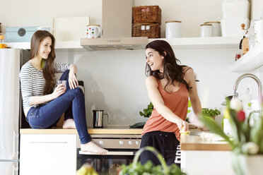 Two happy women in kitchen - PESF000283
