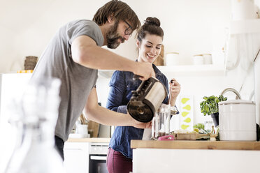 Couple in kitchen preparing coffee - PESF000303