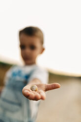 Snail on little boy's palm - JRFF000827