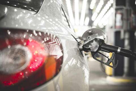 Car with nozzle, fuelling stock photo