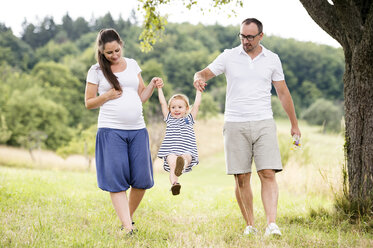 Happy family walking in park - HAPF000724