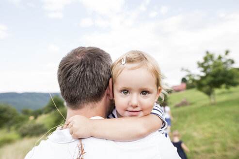 Father carrying little daughter in his arms - HAPF000726