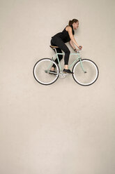 Woman riding bicycle - BAEF001197