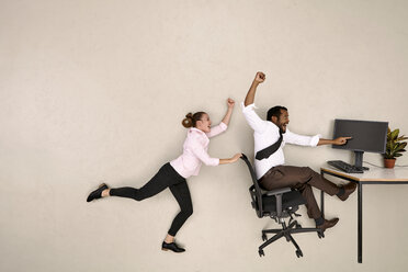 Business colleagues shouting at computer - BAEF001224