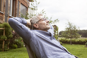 Mature man relaxing in garden - RBF004868