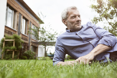 Mature man lying in garden - RBF004879