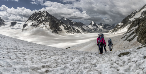 Switzerland, Pennine Alps, Mountaineers at the Otemma Glacier stock photo