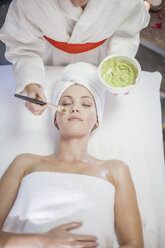 Young woman in spa receiving facial mask - ZEF009552