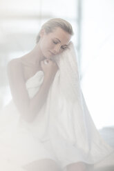 Young woman in spa with towel - ZEF009576
