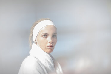 Young woman wearing bathrobe at spa - ZEF009588