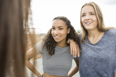 Teenage girls on roof top - OJF000176