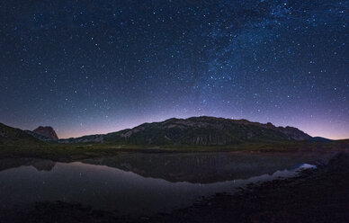 Italy, Abruzzo, Gran Sasso e Monti della Laga National Park, Corno Grande and lake Pietranzoni by night - LOMF000359