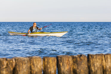Denmark, senior man paddling, kayak - WDF003722
