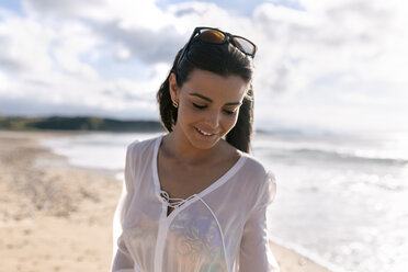 Spain, Asturias, beautiful young woman on the beach - MGOF002212