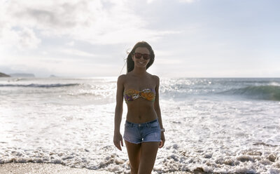 Spain, Asturias, beautiful young woman on the beach - MGOF002213