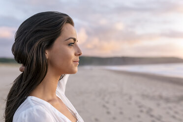 Spain, Asturias, beautiful young woman on the beach - MGOF002241