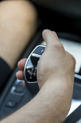 Man's hand on gearshift, close-up - JUNF000610