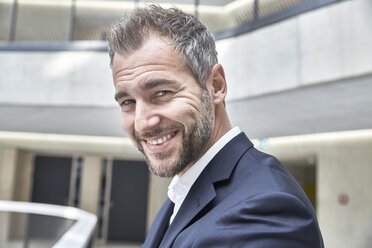 Portrait of smiling businessman - FMKF002922