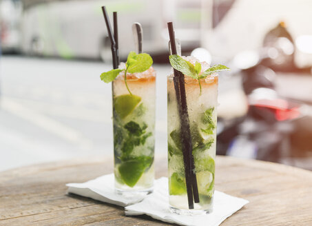 Two glasses of Mojito on table of sidewalk cafe - JUNF000611