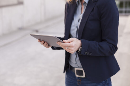 Businesswoman with tablet, partial view - NAF000046