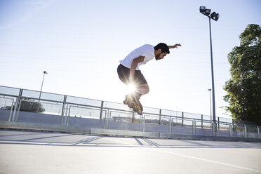 Man with rollerblades jumping during a skating session - ABZF001013