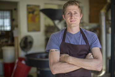 Coffee roasting shop owner in front of shop - ZEF010010