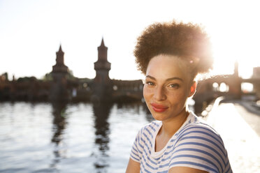 Young woman at Spree river, portrait - FKF002063