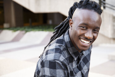 Young black man with dreadlocks, portrait - ABZF001114