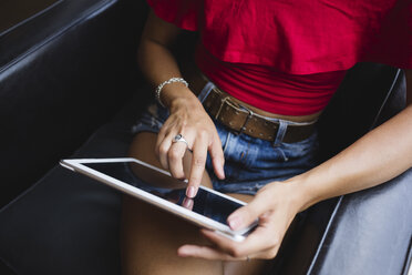 Woman's hand touching display of tablet - MRAF000149