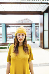 Portrait of young woman wearing yellow autumn fashion - EBSF001704