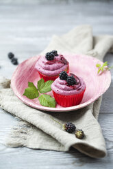 Two cupcakes with blackberry creme - MYF001756