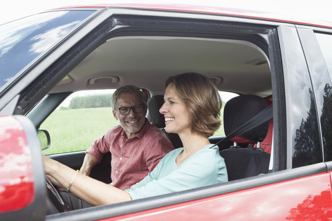 Happy mature couple in car stock photo