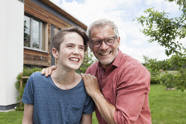 Portrait of proud father with son in garden - RBF005205