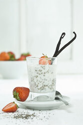 Chia pudding with fresh strawberries and vanilla bean in glass - ASF006017