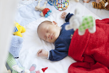 Baby sleeping in playpen with toys - MFF003138