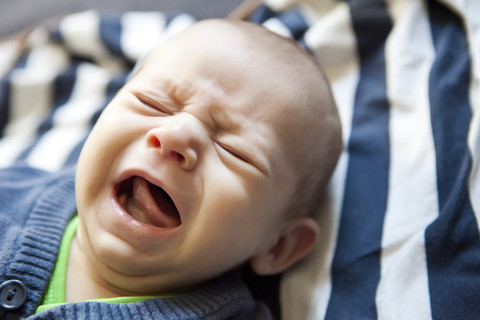 Baby crying stock photo