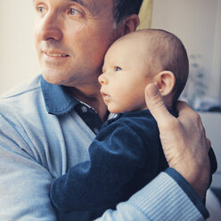 Grandfather holding his baby grandson - MFF003151